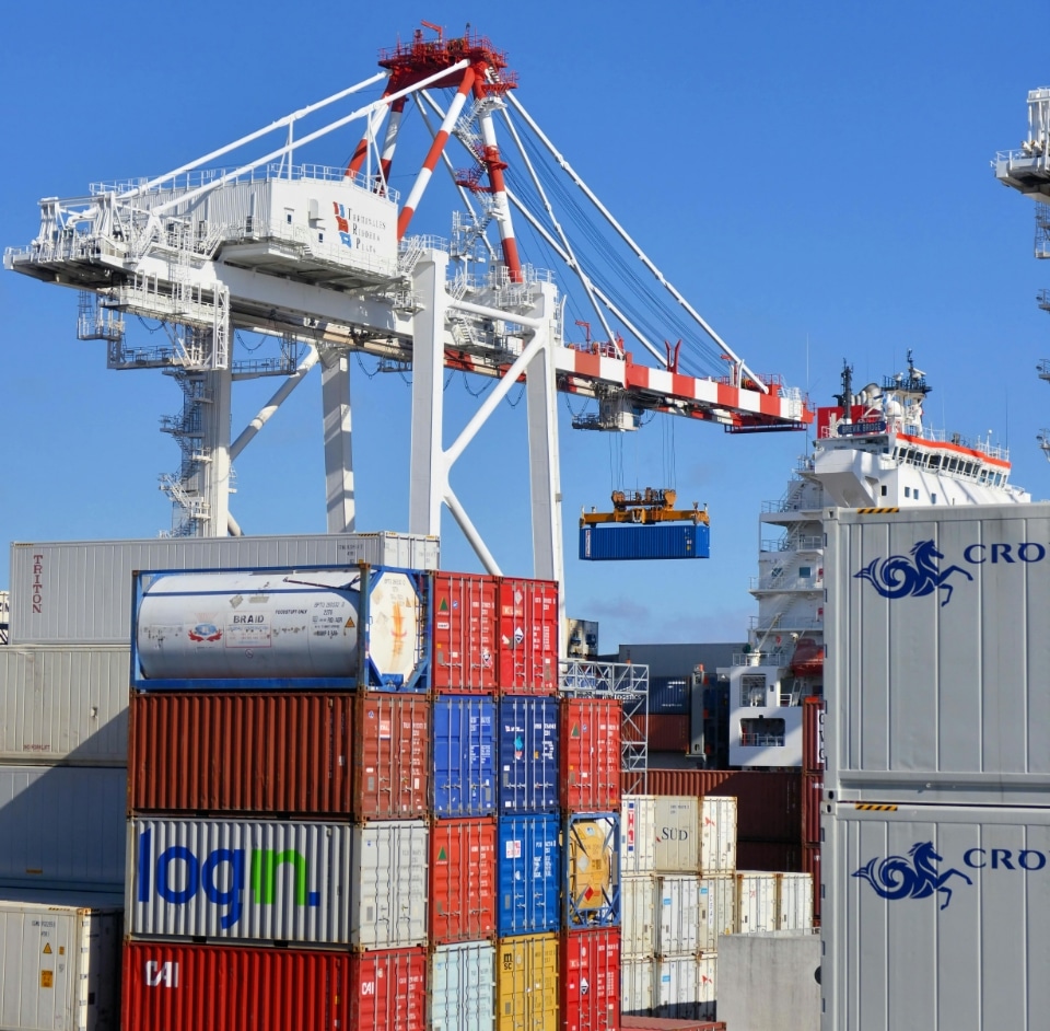 loading-freight loading a barge with shipping containers